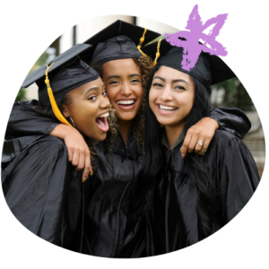 group of three young women in caps and gowns, hugging and smiling at the camera